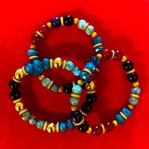3 jewel toned beaded bracelets
